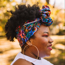 Load image into Gallery viewer, black woman wearing colorful head wrap outside with trees behind her
