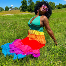 Load image into Gallery viewer, a black model is wearing a rainbow halter tiered maxi dress outside in the grass
