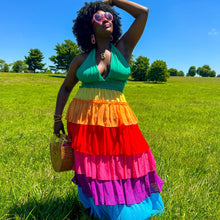 Load image into Gallery viewer, a black model is wearing a rainbow halter tiered maxi dress outside in the grass
