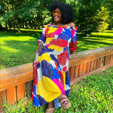 Load image into Gallery viewer, black woman with afro outside in park wearing an off the shoulder colorful mixed print maxi dress
